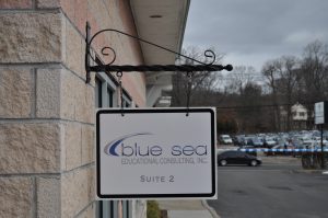 Madison Wayfinding Signs outdoor hanging blade sign blue sea building business wayfinding address sign 300x199